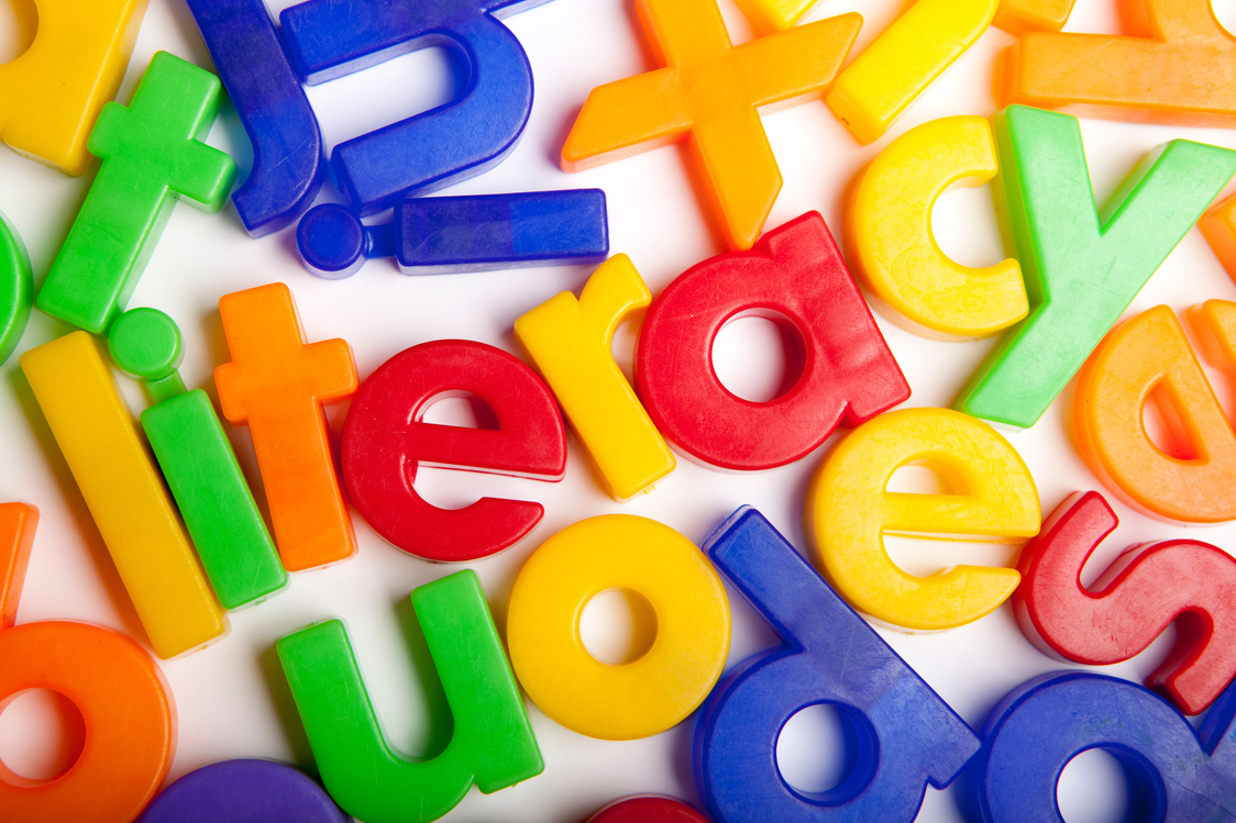 the word literacy in colorful letters